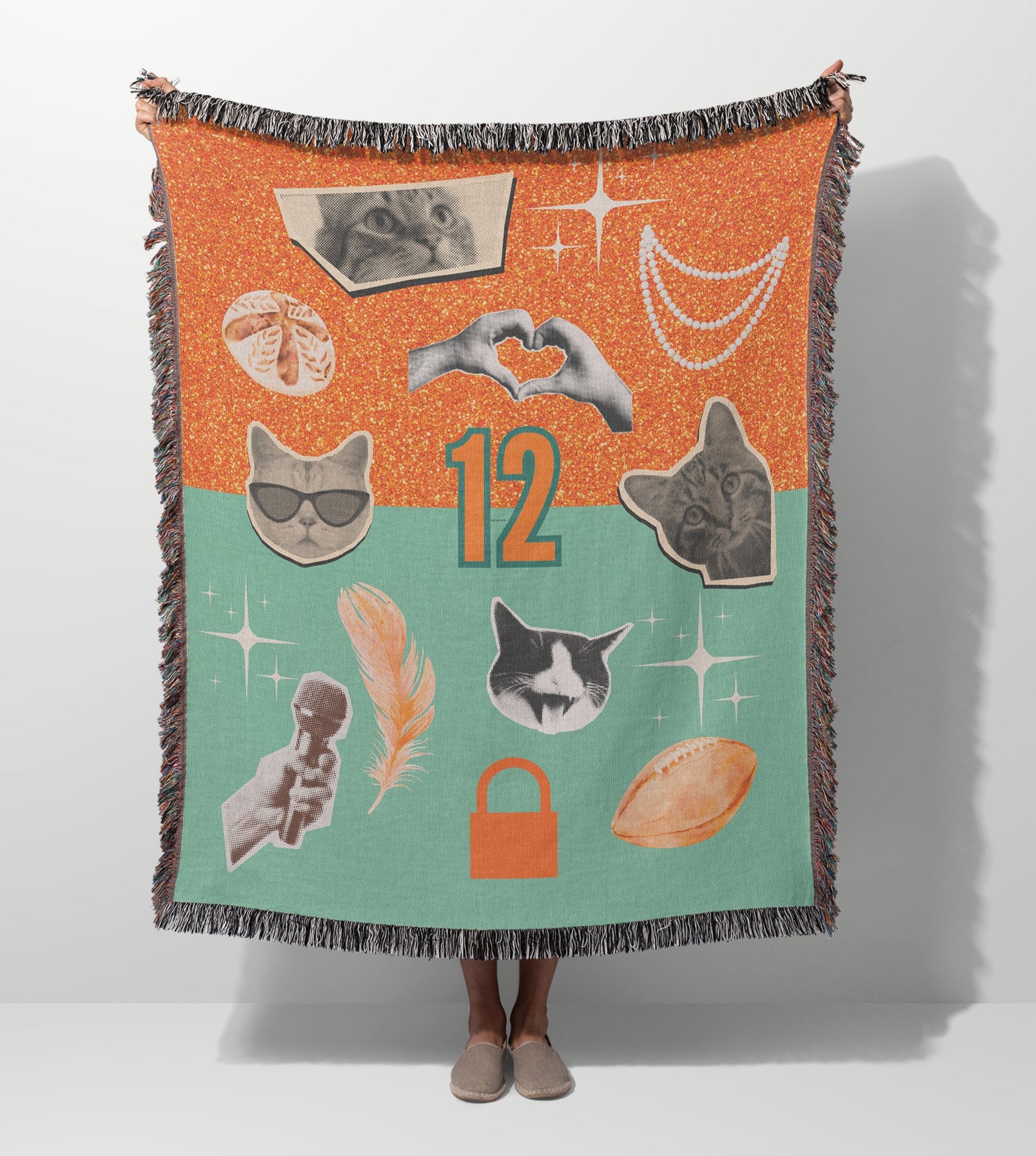 Decorative throw blanket with various icons on an orange and green background