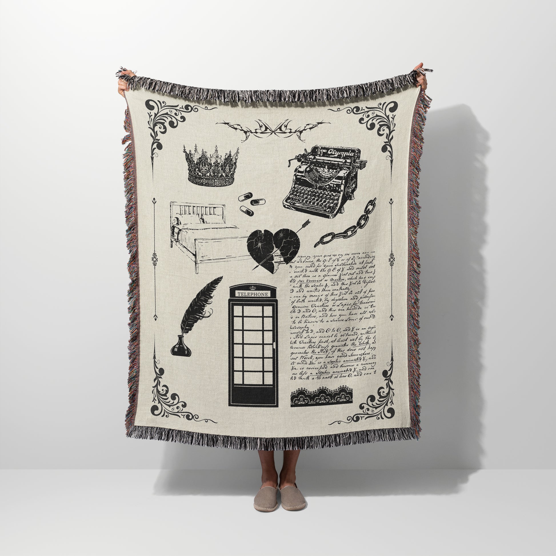 A person holding a woven blanket with design elements inspired by the Tortured Poet Music Video with blanket and white color scheme.