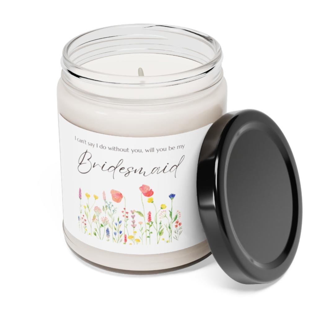 A picture of a glass jar of our lit soy candle that says: I cant say I do without you, will you be my Bridesmaid. There is a lovely painted style wild flower graphic underneath the sayings.