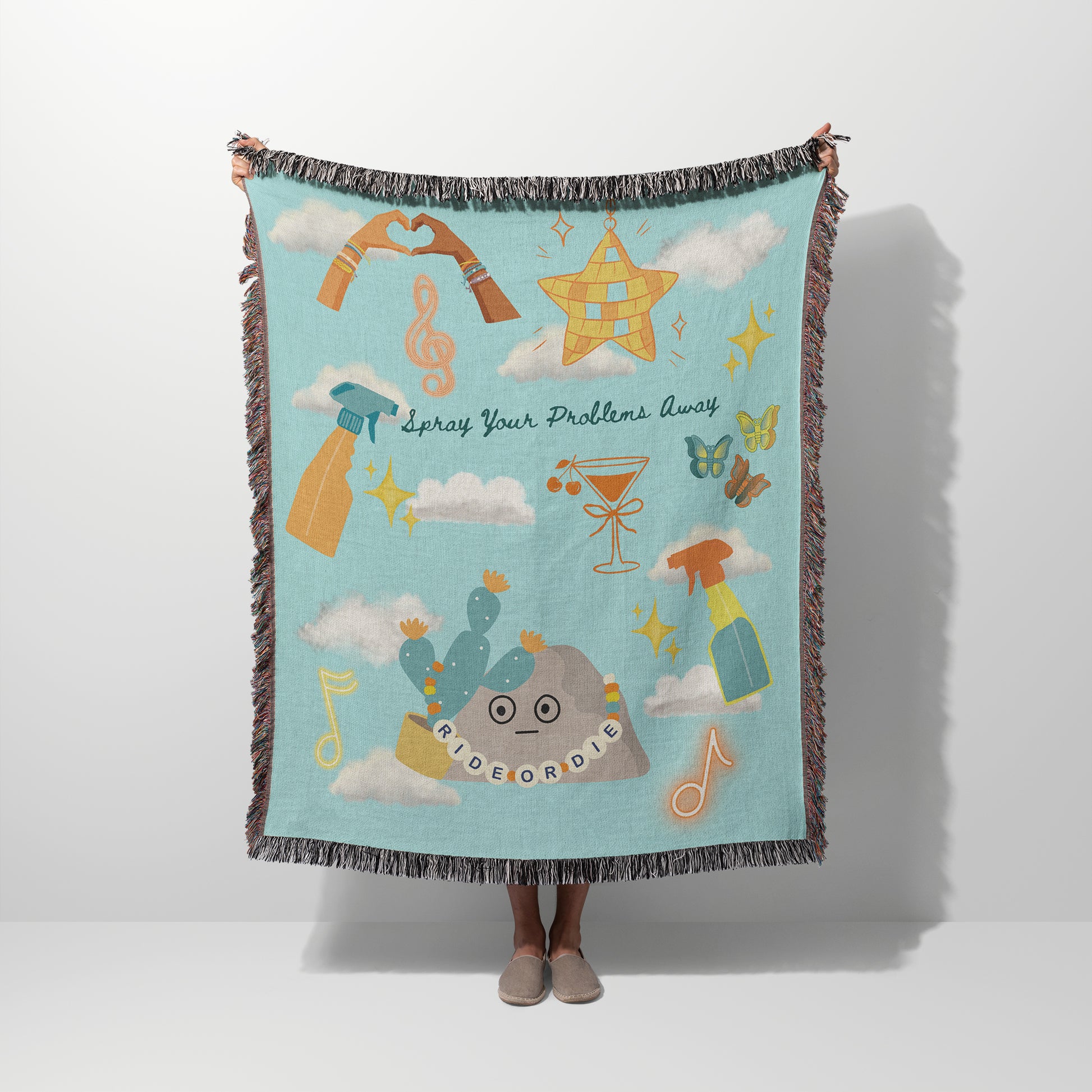 Person holding a colorful blanket with design elements inspired by Taylor's latest Music Video 