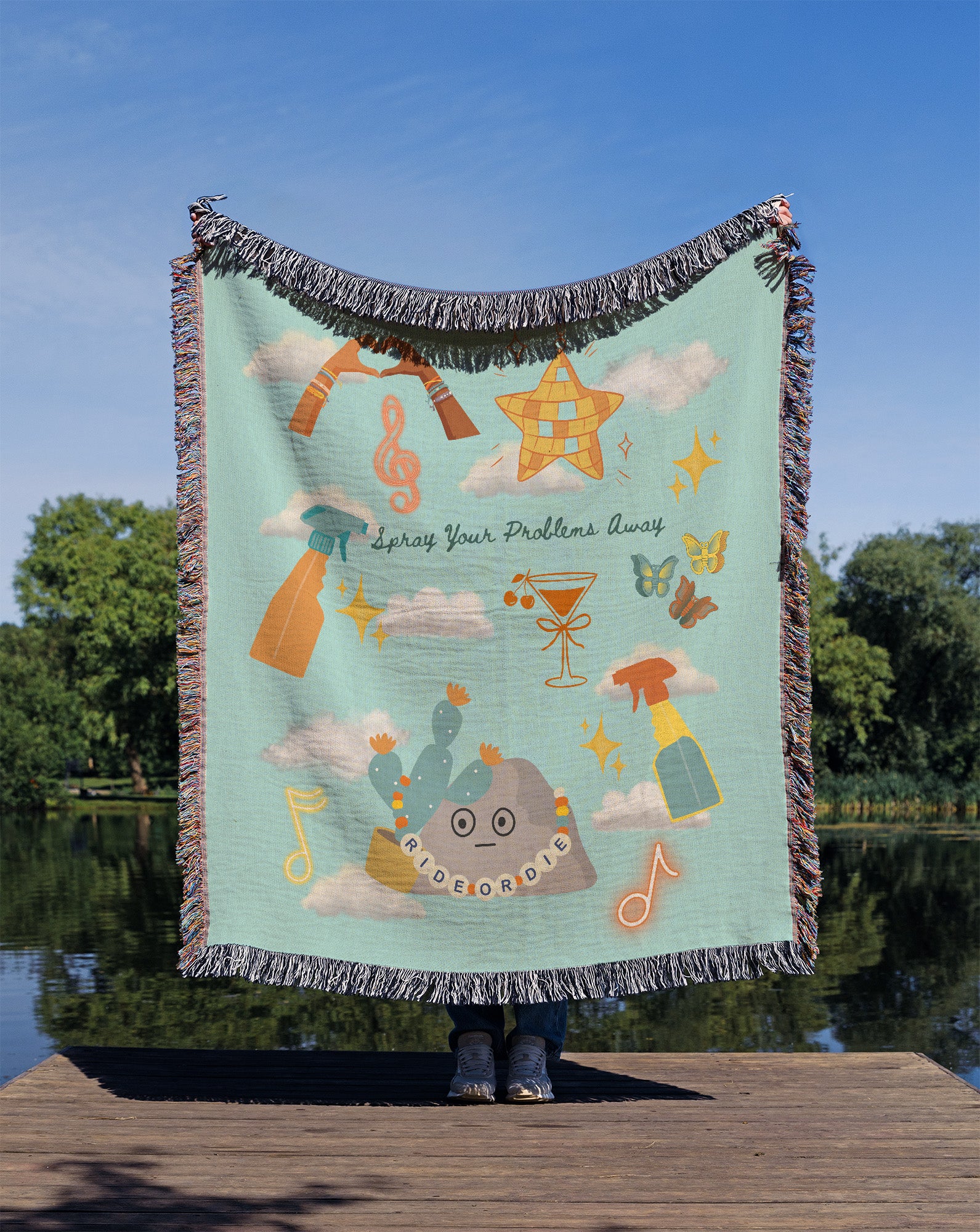 Person holding a colorful blanket with design elements inspired by Taylor's latest Music Video 